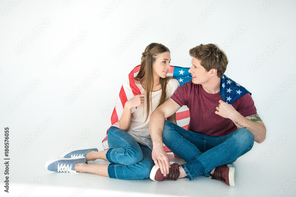 young couple with american flag young couple with american flag