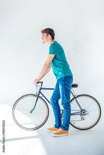 young man with bicycle