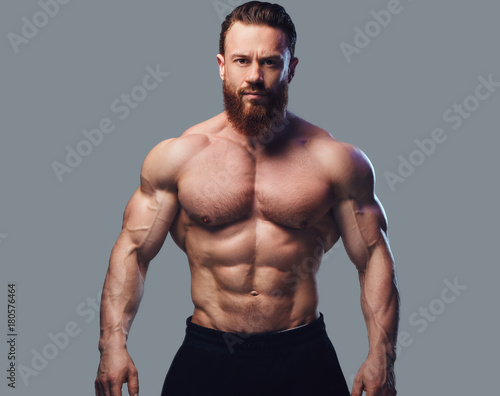 Portrait of bearded shirtless bodybuilder.