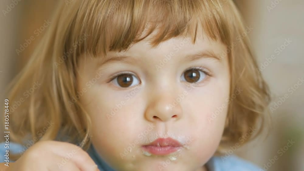 Smiling little boy Eating close up. 4K UHD Smiling little boy Eating close up. 4K UHD