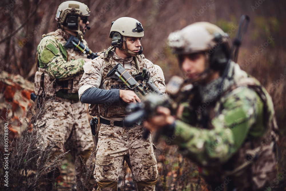 Fototapeta premium soldiers or private military contractors aiming with rifle. war, army, weapon, technology and people concept.