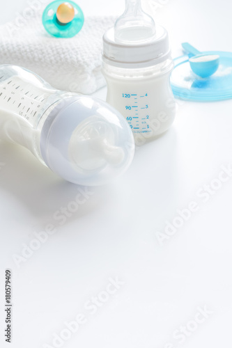 Fototapeta Naklejka Na Ścianę i Meble -  preparation of mixture baby feeding on white background