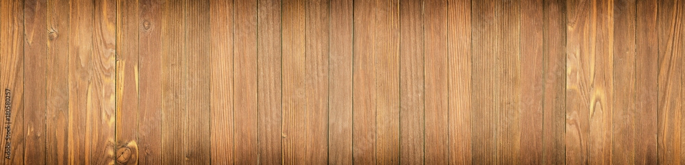 Panoramic view of a wooden table, wood texture close-up Panoramic view of a wooden table, wood texture close-up