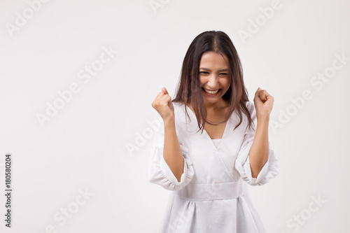 excited asian woman looking up