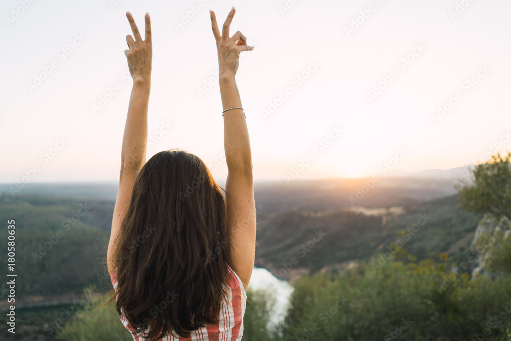 Cheerful woman in bright light on nature Cheerful woman in bright light on nature