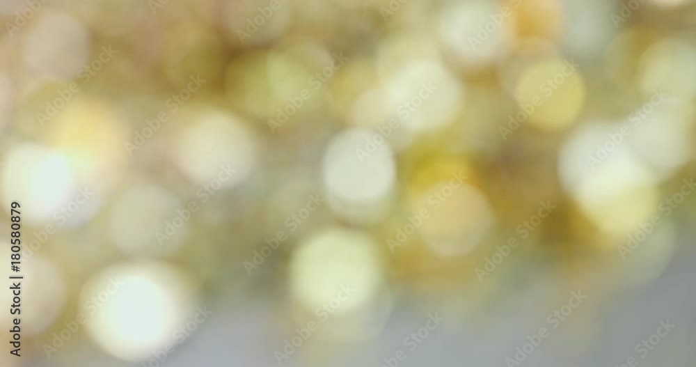 Abstract Christmas background of golden decorations with flares and sparkles Abstract Christmas background of golden decorations with flares and sparkles