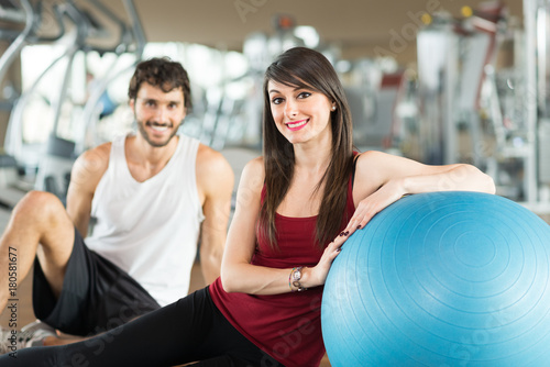 Smiling couple in a gym
