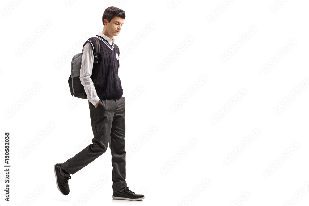 Pensive teen student walking Pensive teen student walking