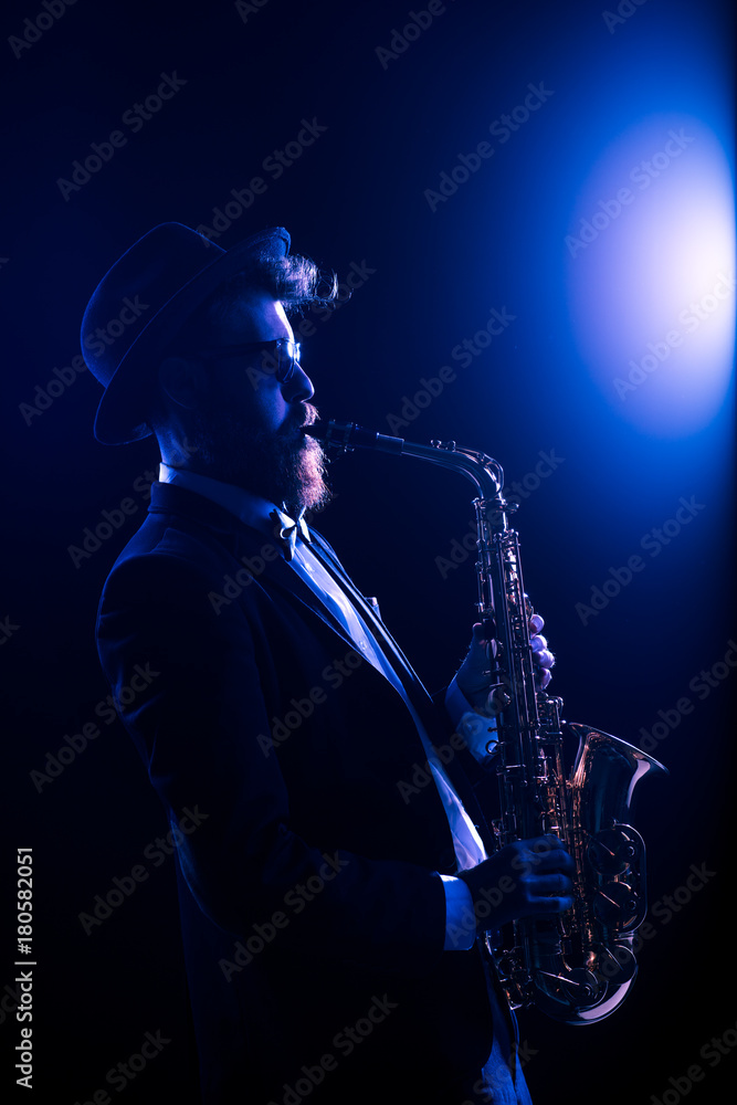 Fototapeta premium Jazz musician performing with a saxophone