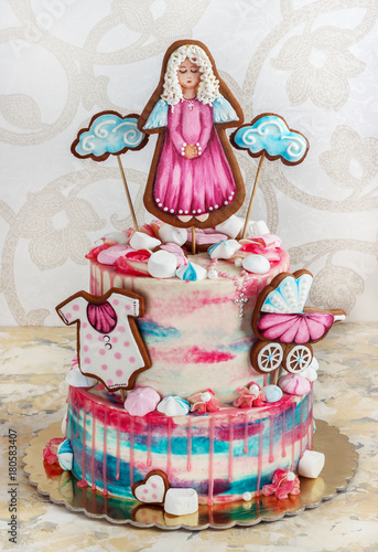 a multi-tier cake for baptism for a girl with gingerbread