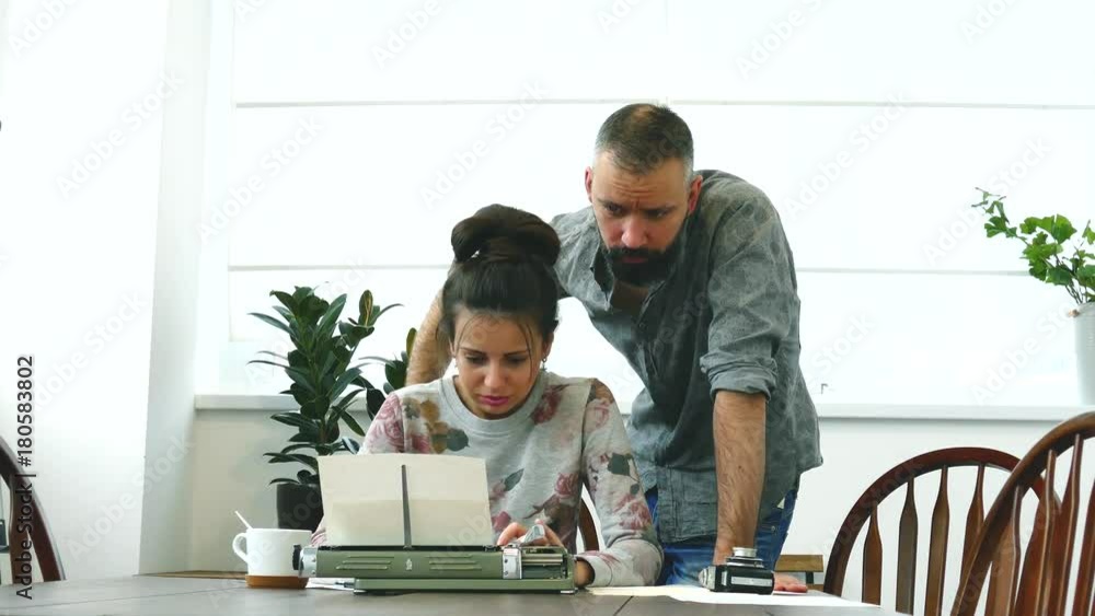 Two writers man and woman at work Two writers man and woman at work