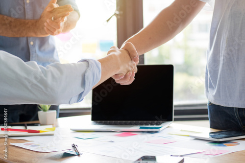 Business people shaking hand to cooperate and deal in business successful. photo