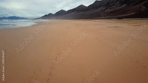 Timelapse take-off from the desert beach Playa de Barlovento, Jandia Peninsula on Fuerteventura, Canary Islands, Spain photo