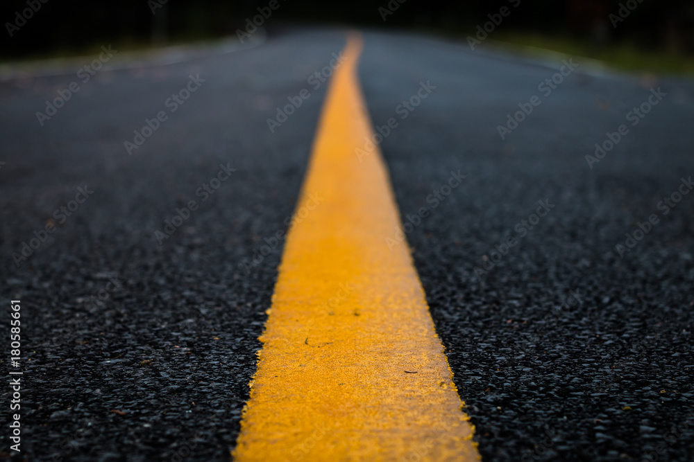 Close up line yellow asphalt road texture background.
