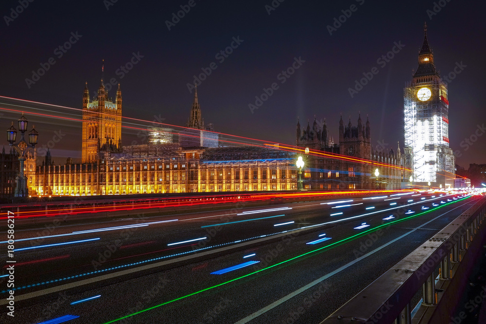 Night scene with light trails on the Westminster bridge. Big Ben and House of Parliament in London, The United Kingdom of Great Britain.