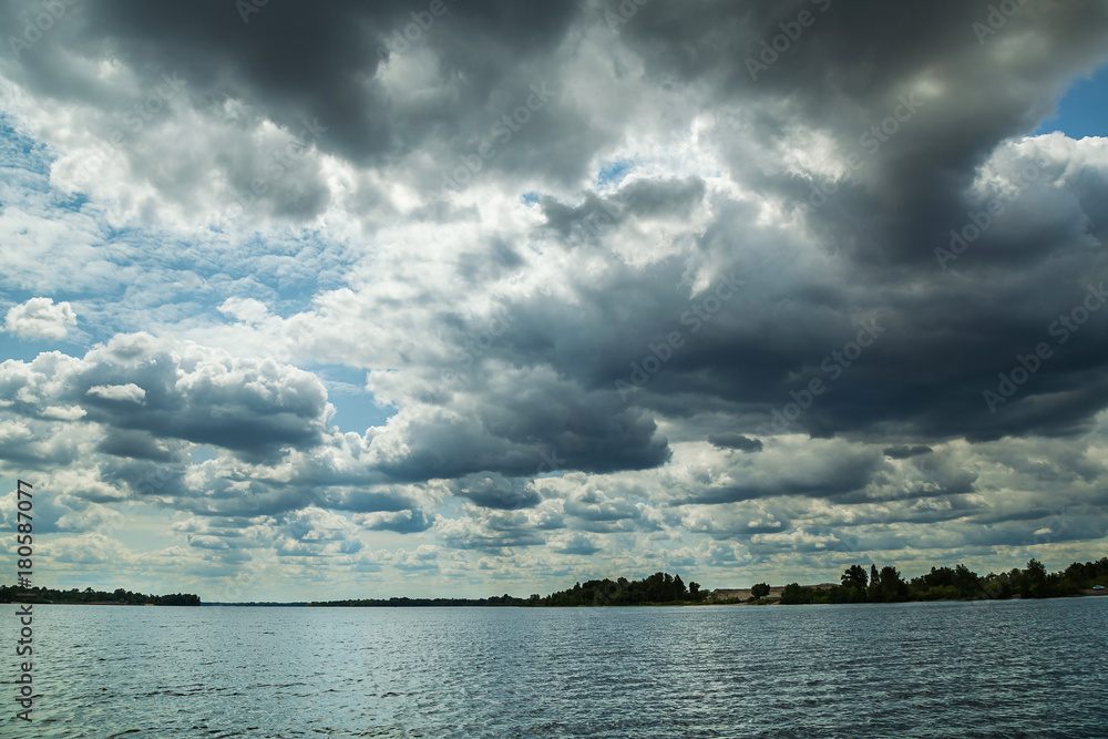 stormy clouds over the river, beautiful clouds over the water