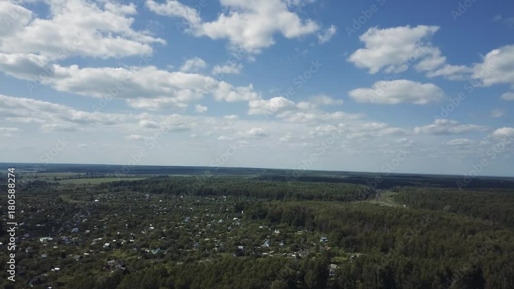 Aerial: Horizon with clouds and forest, slowly reduced the drone Aerial: Horizon with clouds and forest, slowly reduced the drone