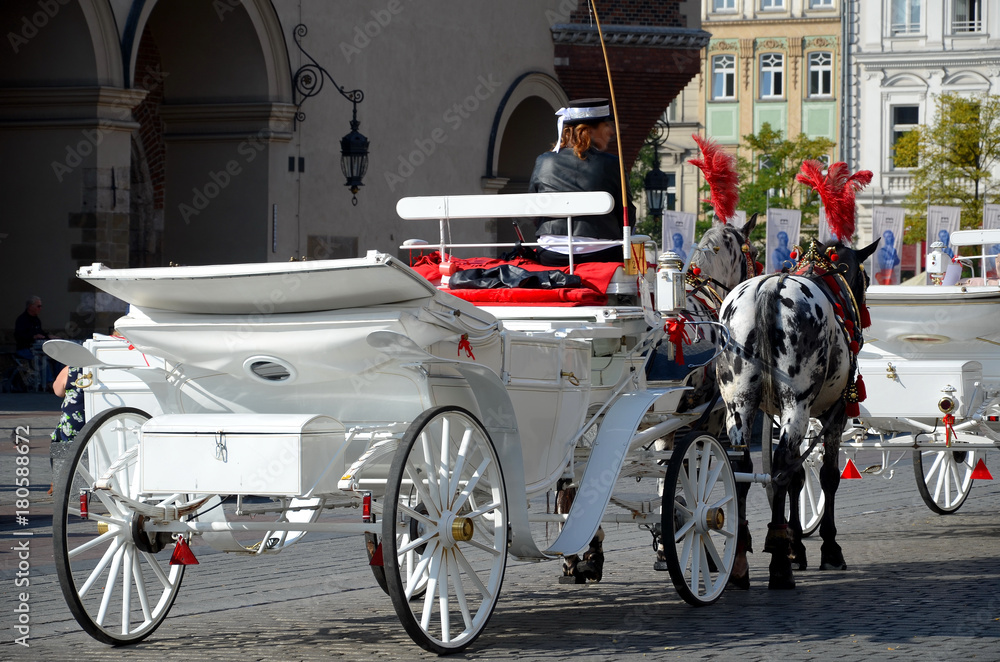 Cab on the main square - old town in Krakow, Poland