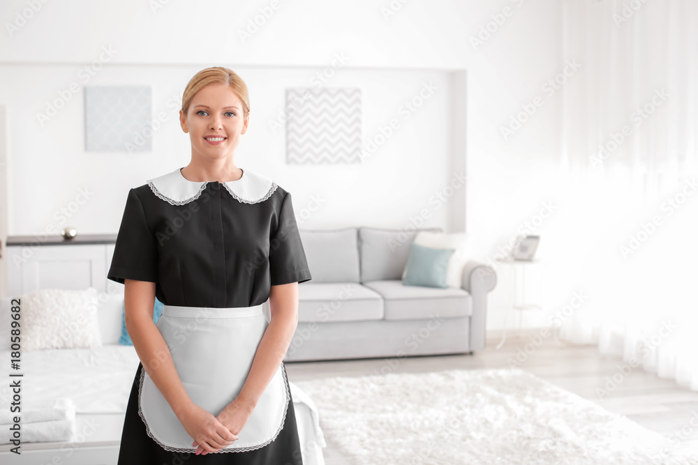 Beautiful chambermaid in room Beautiful chambermaid in room