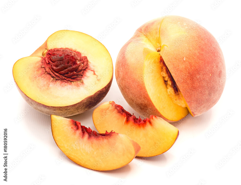 Peaches, one half and cut open, two slices, isolated on white background. Peaches, one half and cut open, two slices, isolated on white background.