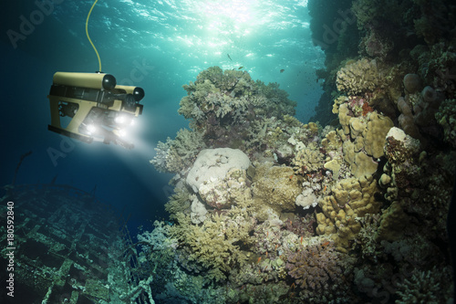 Robot inspects a sunken ship deep under water