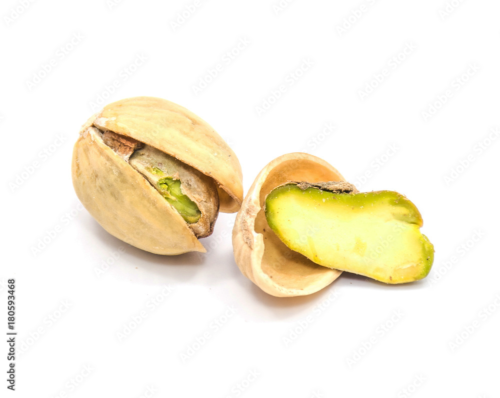 Pistachio nuts isolated on white background, one open, one half in shell. Pistachio nuts isolated on white background, one open, one half in shell.