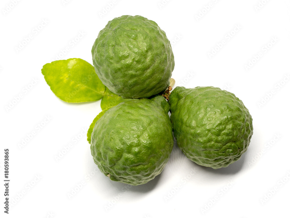 close up group of fresh bergamot with green leaves isolated on white background. benefits of bergamot for beauty and health concept close up group of fresh bergamot with green leaves isolated on white background. benefits of bergamot for beauty and health concept