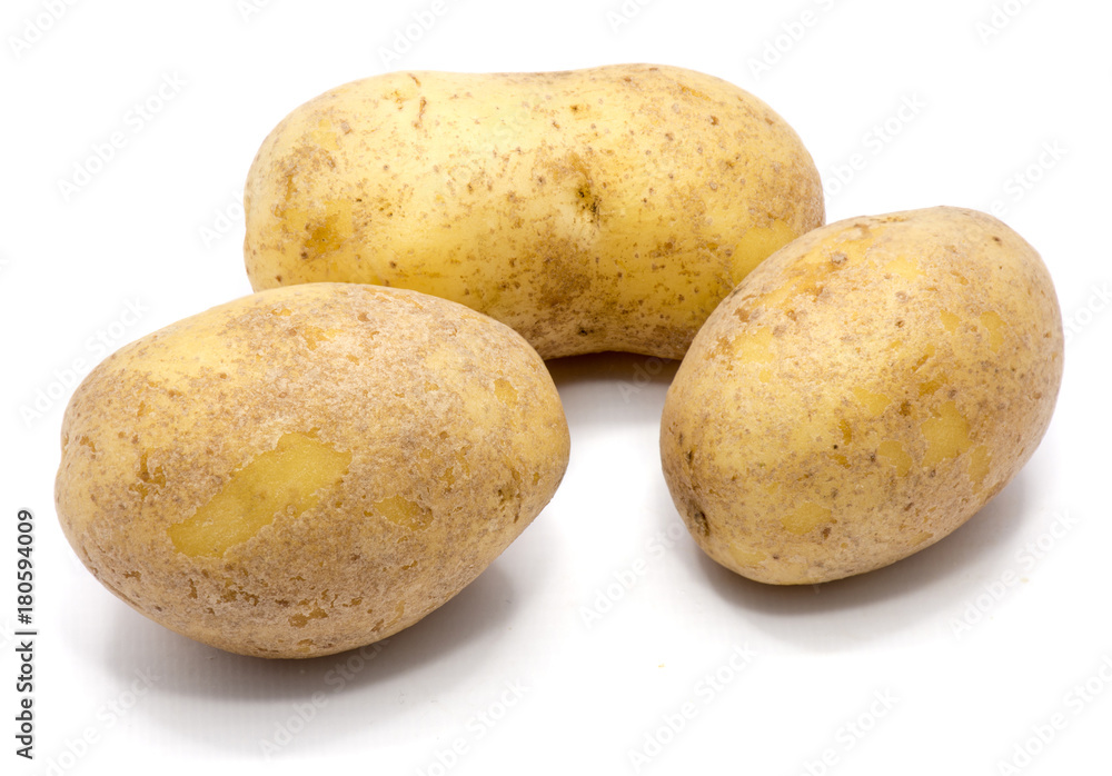 Three whole potatoes isolated on white background. Three whole potatoes isolated on white background.