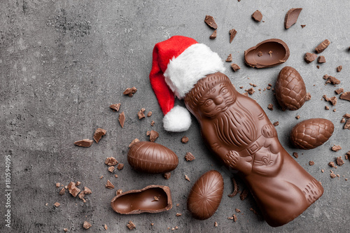Delicious Christmas chocolate and sweets on rustic background