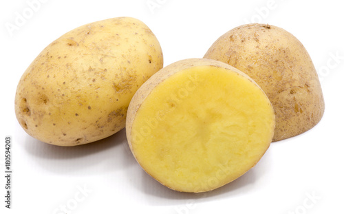 One whole potato and two halves isolated on white background.
