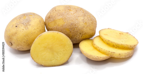 Two whole potatoes, half and slices isolated on white background.