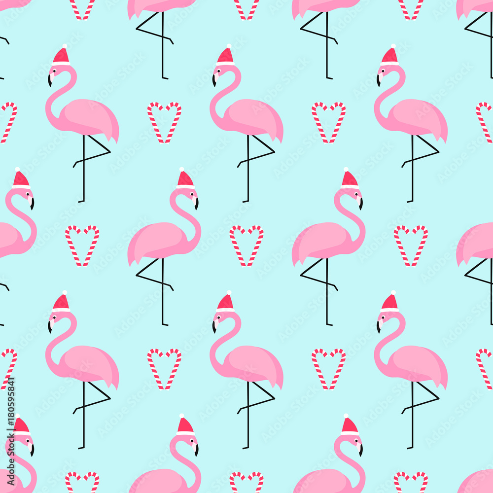 Fototapeta premium Flamingo in xmas hat with candy cane heart seamless pattern. Exotic New Year art background. Design for fabric, wallpaper, textile and decor.