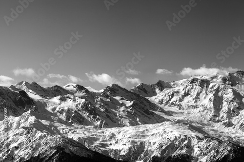 Black and white snow winter mountains in nice sunny day © BSANI