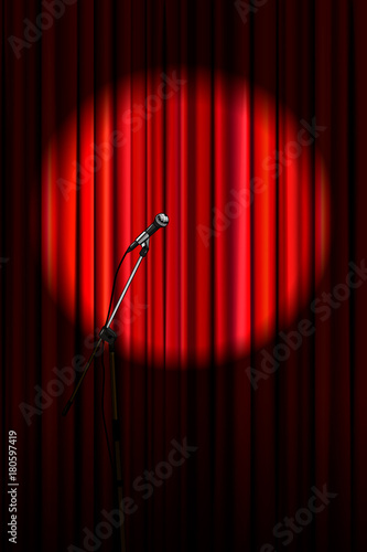 Bright red curtain with microphone in round spotlight lighting, retro theater stage vertical background