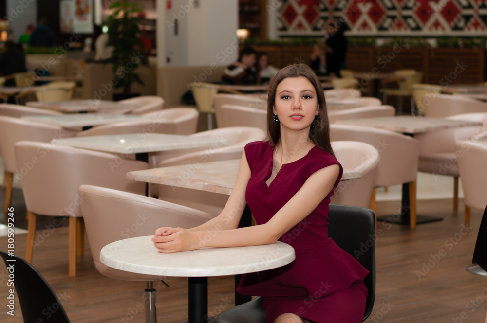 young pretty woman sits in modern cafe young pretty woman sits in modern cafe