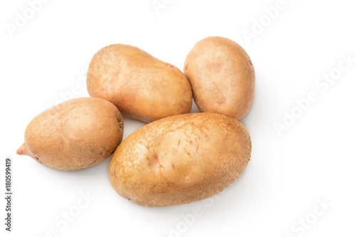 Uncooked, unpeeled, fresh whole potatoes isolated on white background