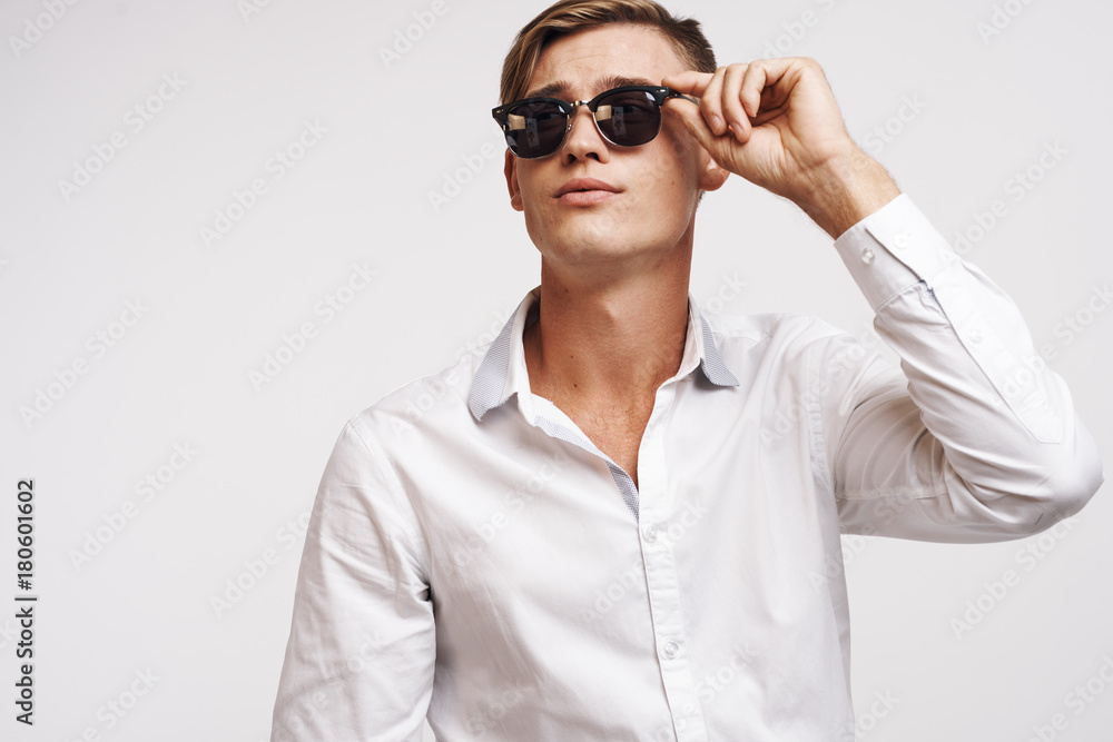young guy with glasses looks up young guy with glasses looks up