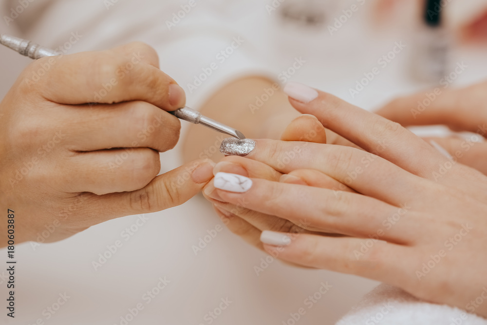 Manicurist does manicure Manicurist does manicure