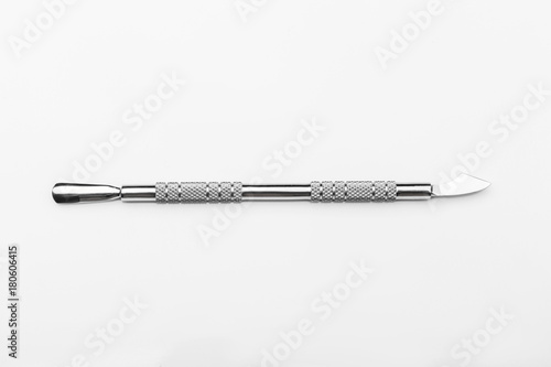professional manicure tools on a white background. Cuticle pusher
