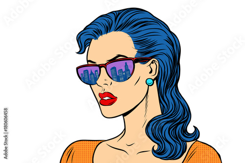Woman in sunglasses with the reflection city