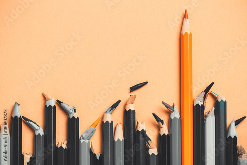 creative idea, the concept of the strength of a people character, background of pencils, success in comparison with defeat, colored against the of black and white