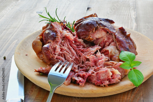 Photography Smoked ham hock cooked, crock pot ham on wooden plate