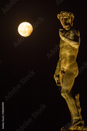 A Ball of Light, Piazzale Michelangelo, Florence, Tuscany, Italy, Europe Statue of David by Michelangelo the evening of the 7th August 2017 with the Full Moon at Partial Eclipse.