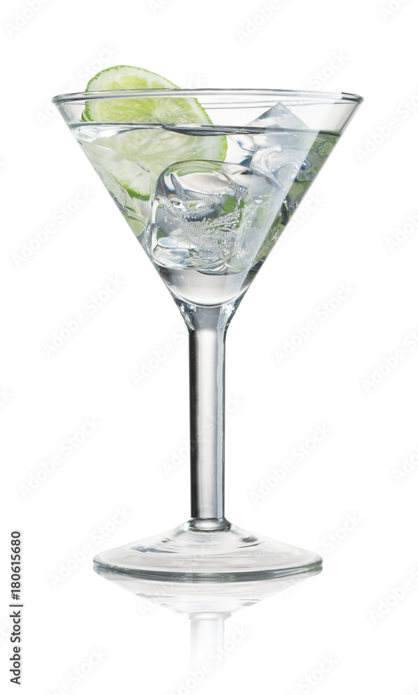 Glass of water with ice and slice of lime isolated on white background