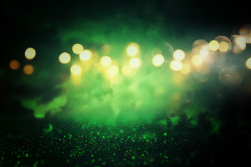 Green glitter vintage lights background. de-focused.