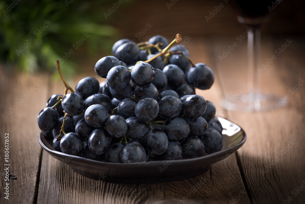 Dark grape in bowl.