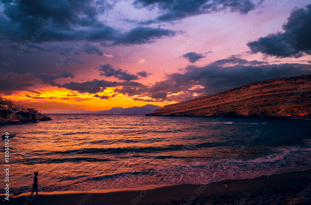 Sunset at Matala beach on Crete island, Greece