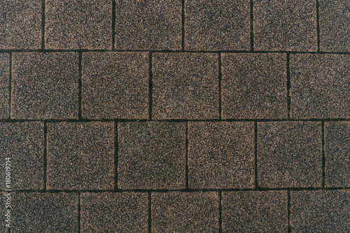 Grey brick stone street road. Light sidewalk, pavement texture. Road