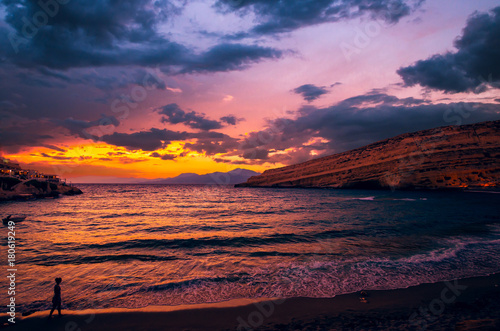 Sunset at Matala beach on Crete island, Greece