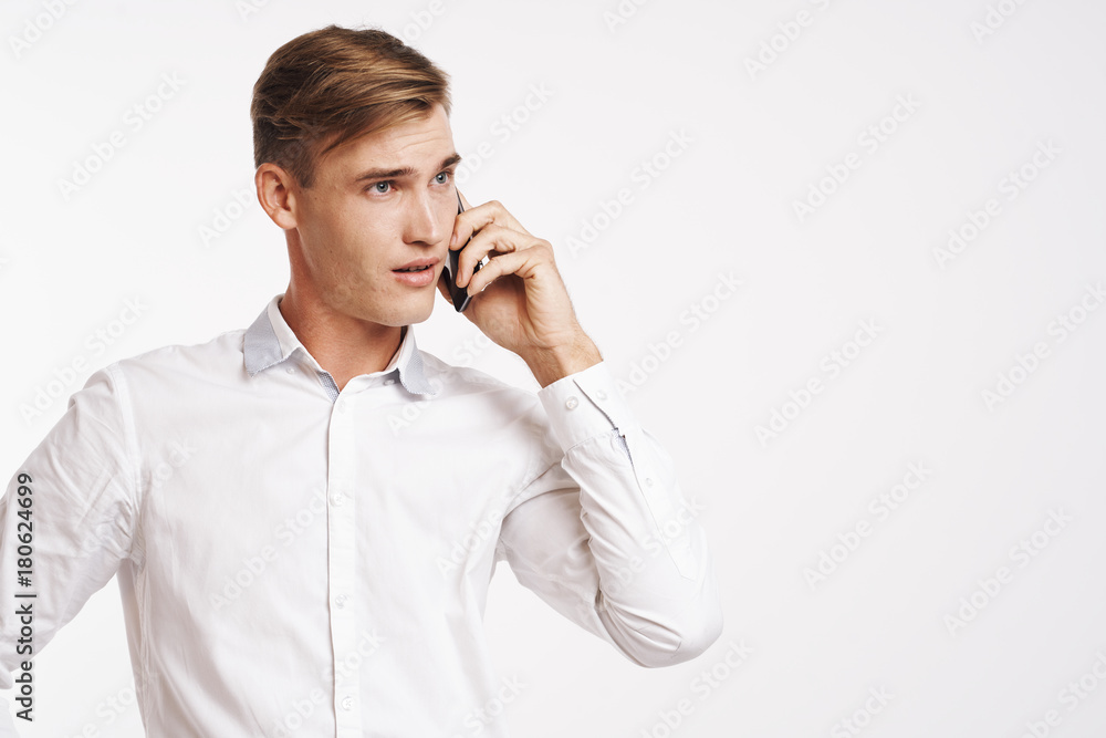 business man talking on the phone on a light background business man talking on the phone on a light background